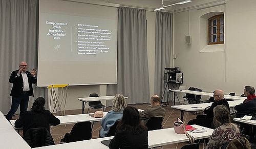 Prof. Sławomir Łukasiewicz giving his presentation and speaking to the audience